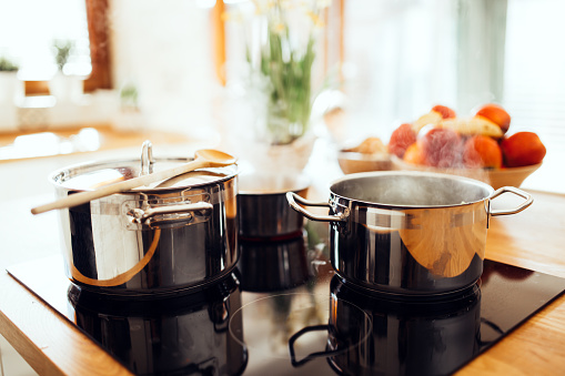 piles of stainless steel cookware 