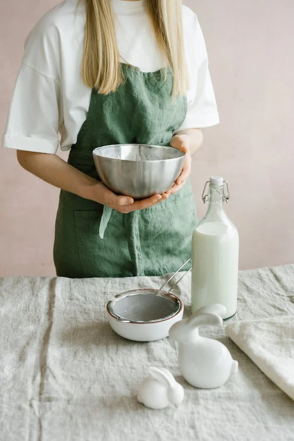 a lady holding a ss bowl