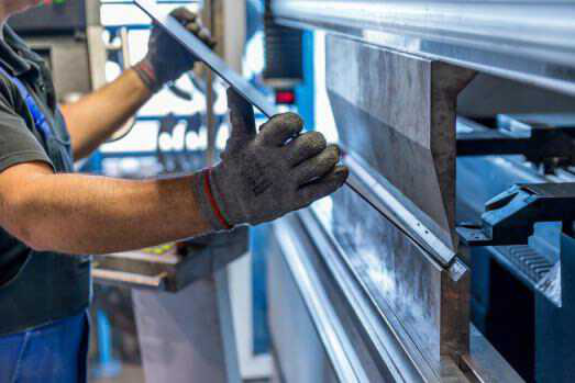 operator working cut and bending metal sheet