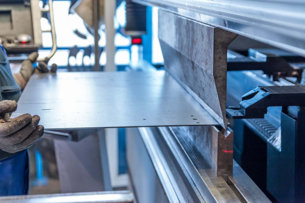 the worker cutting the stainless steel sheet