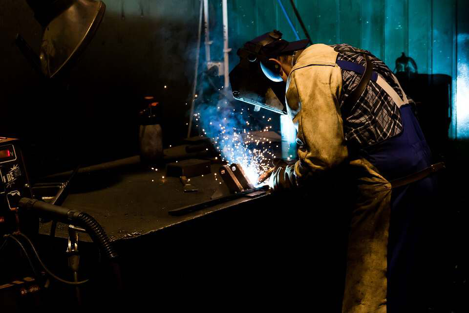 a worker welding the stainless steel product 